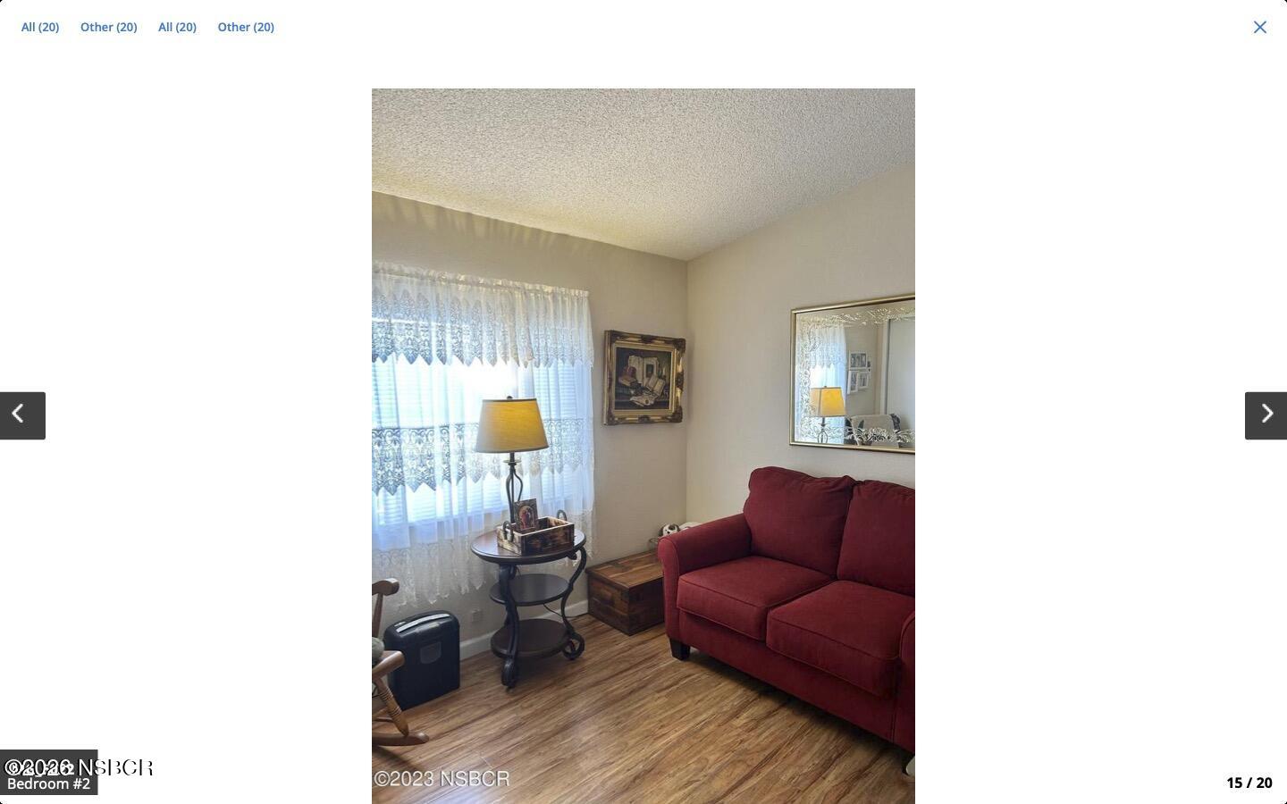 3210 Santa Maria Way, Unit 77 Santa Maria, CA 93455 - Photo 11 of 16 a living room with furniture and wooden floor