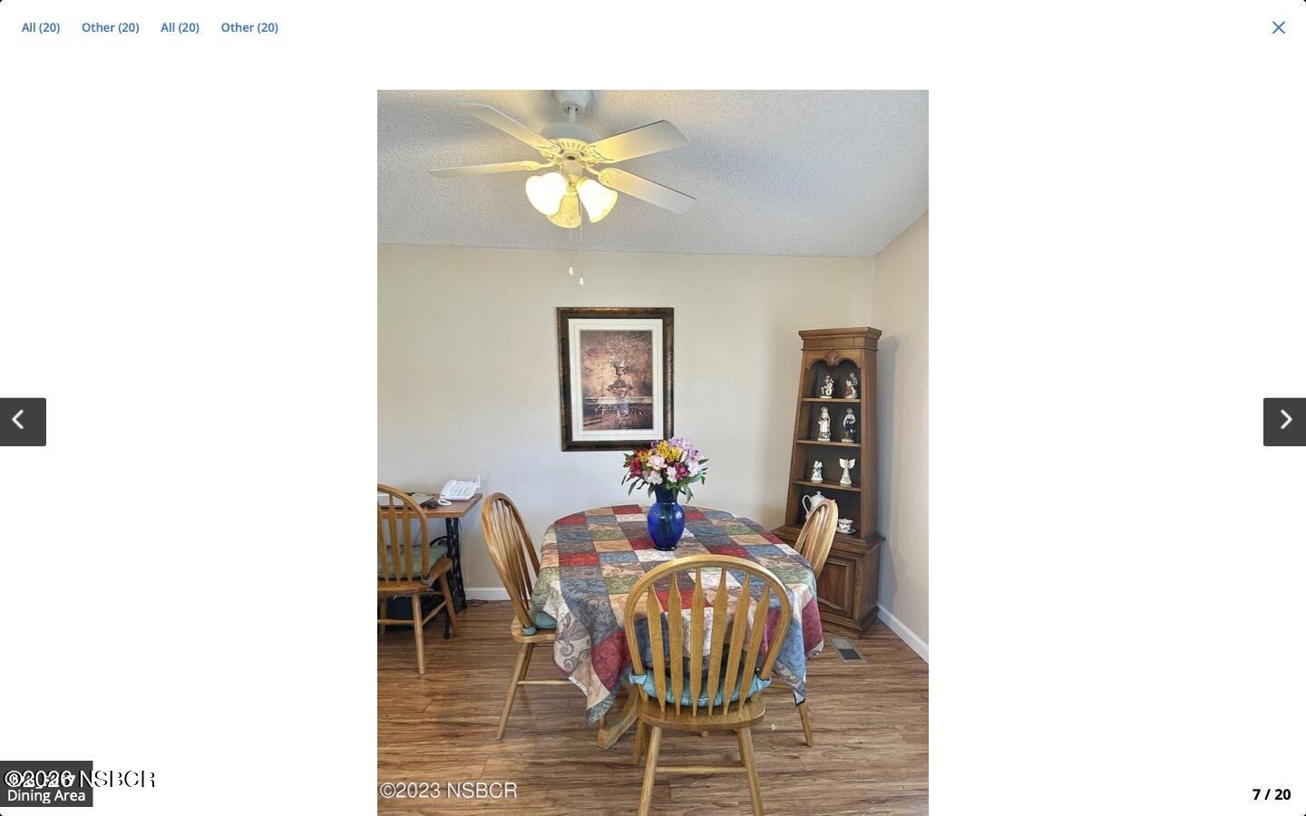 3210 Santa Maria Way, Unit 77 Santa Maria, CA 93455 - Photo 4 of 16 a dining room with furniture and wooden floor