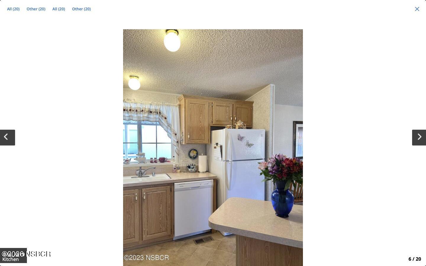 3210 Santa Maria Way, Unit 77 Santa Maria, CA 93455 - Photo 5 of 16 a living room with a sink and a refrigerator