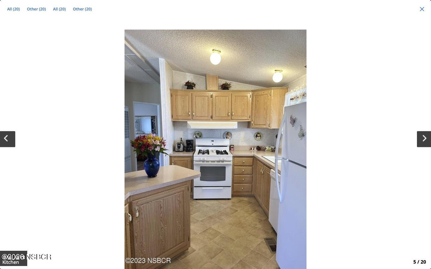 3210 Santa Maria Way, Unit 77 Santa Maria, CA 93455 - Photo 6 of 16 a kitchen with a sink cabinets and stainless steel appliances
