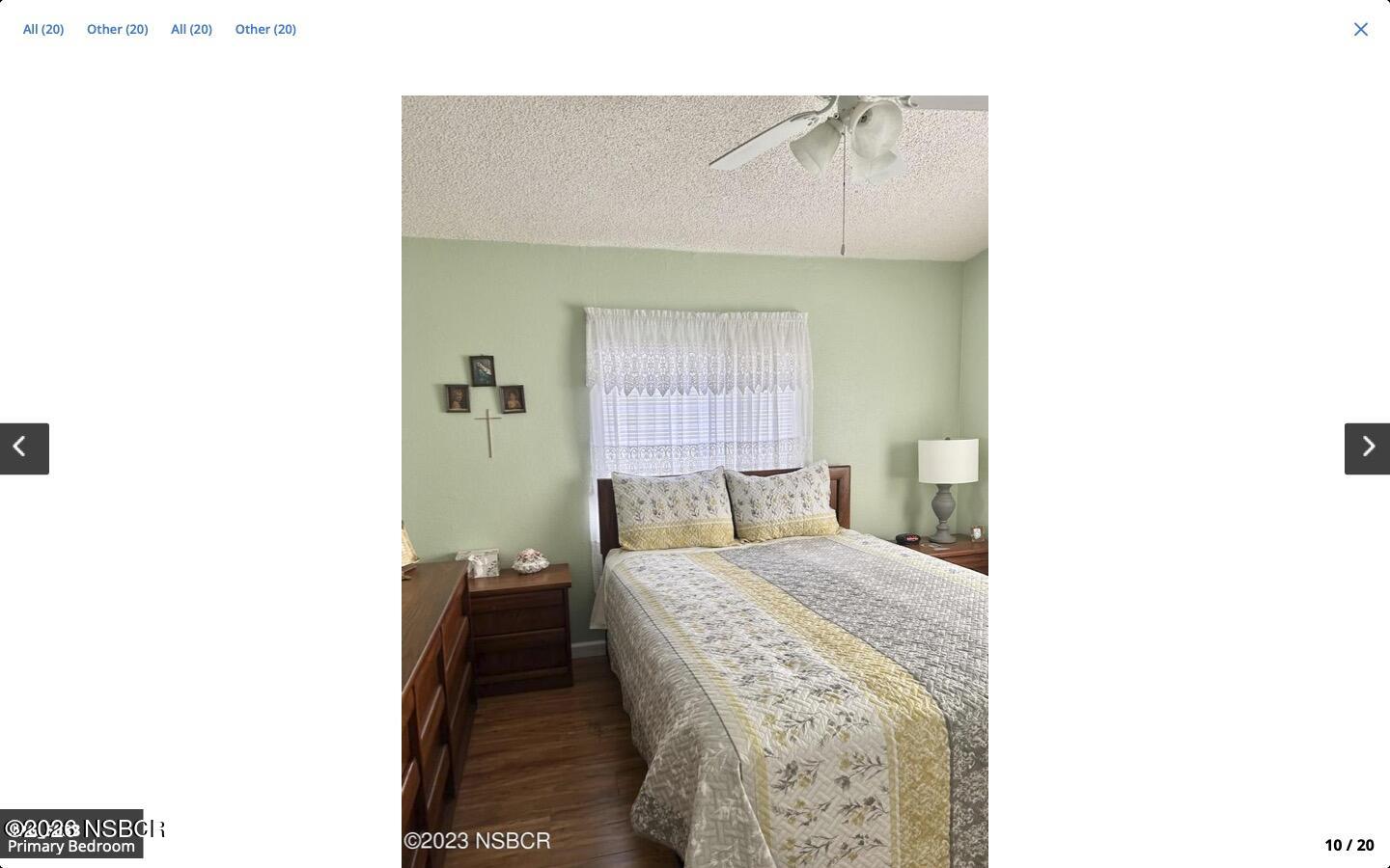 3210 Santa Maria Way, Unit 77 Santa Maria, CA 93455 - Photo 8 of 16 a bedroom with a bed and a lamp