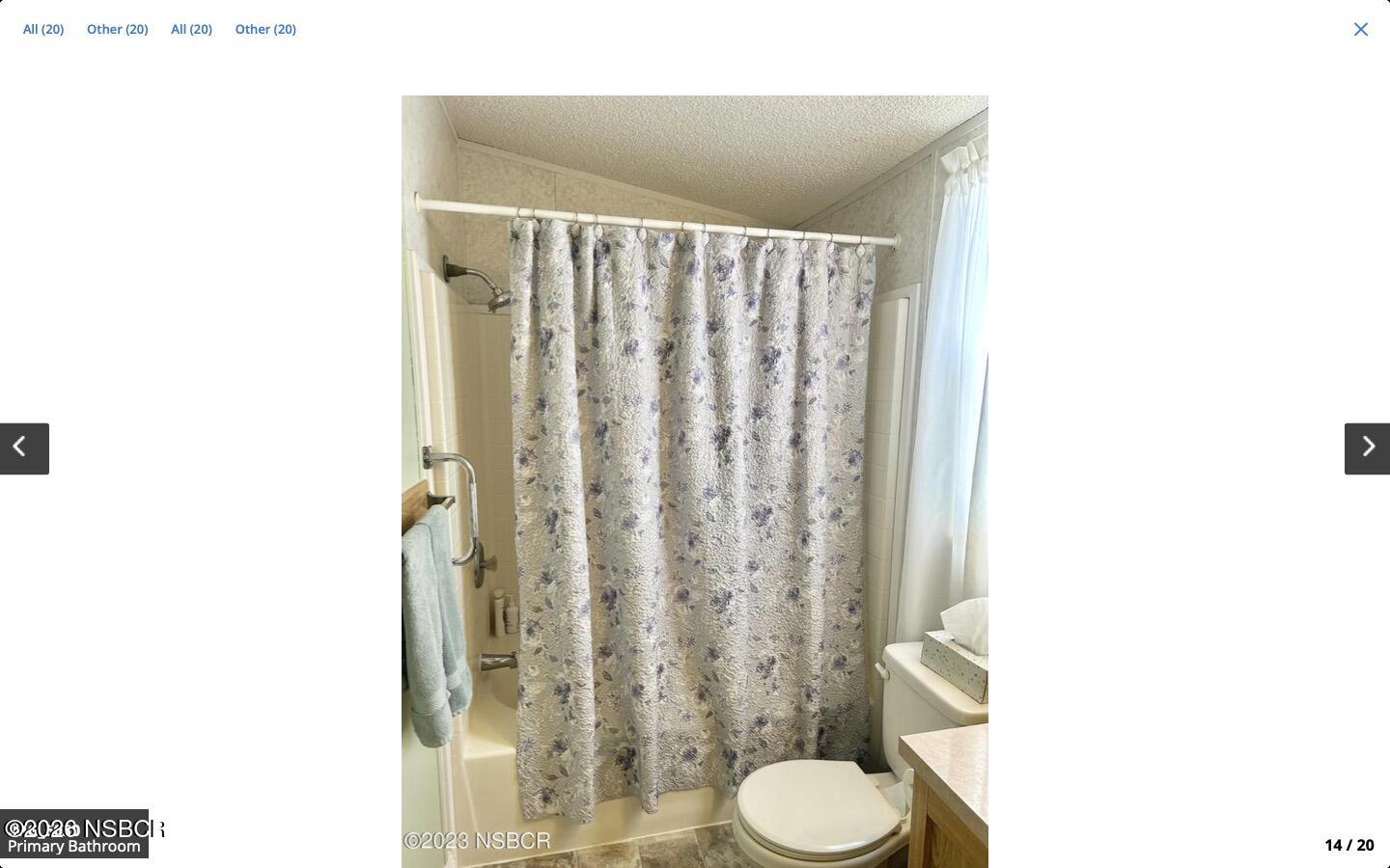 3210 Santa Maria Way, Unit 77 Santa Maria, CA 93455 - Photo 10 of 16 a bathroom with a shower curtain