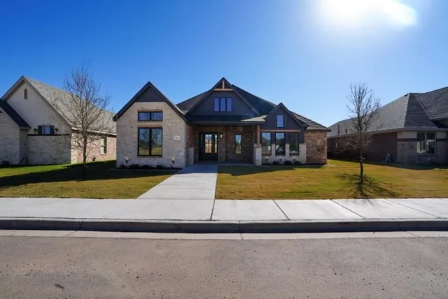 a view of house with yard and entertaining space