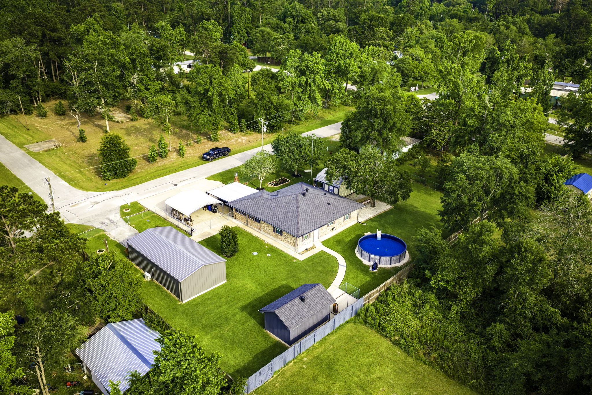 188 Huckleberry Road Onalaska, TX 77360 - Photo 48 of 49 an aerial view of residential house with outdoor space and swimming pool