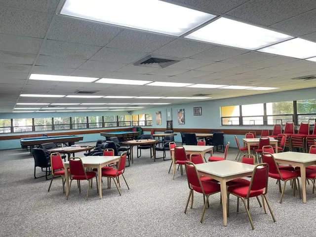 a patio with a table and chairs