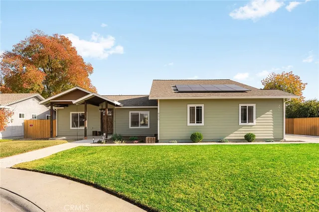 a front view of house with yard and green space