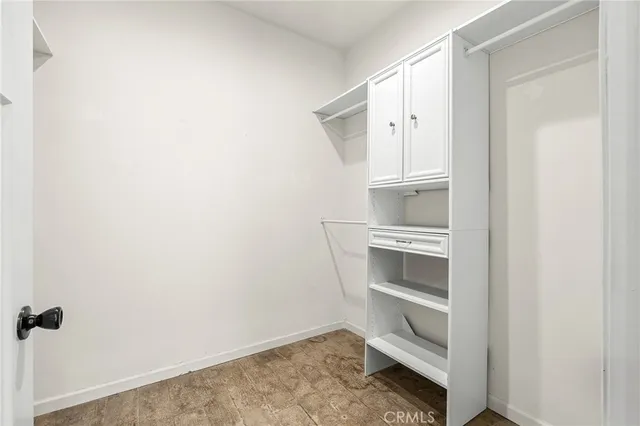 a view of an empty walk in closet