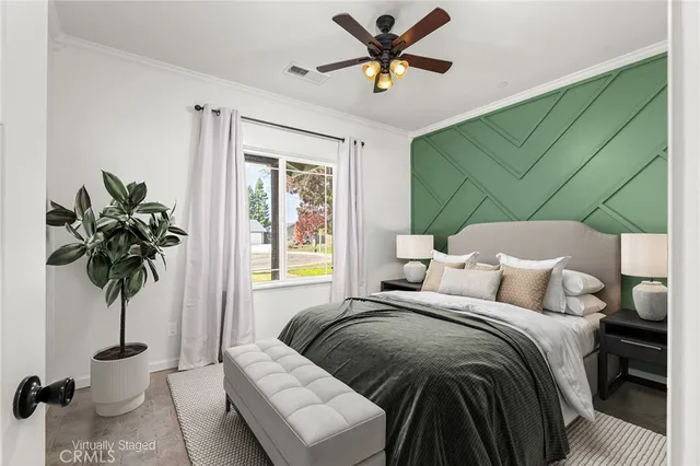 a view of a livingroom with a ceiling fan and a window