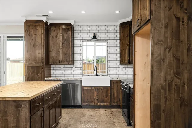a bathroom with a granite countertop sink a toilet and shower