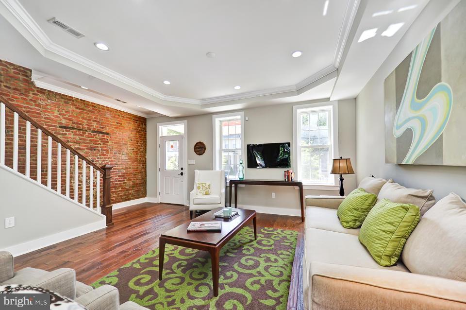 1110 Orren Street Northeast Washington, DC 20002 - Photo 1 of 30 a living room with furniture and a flat screen tv