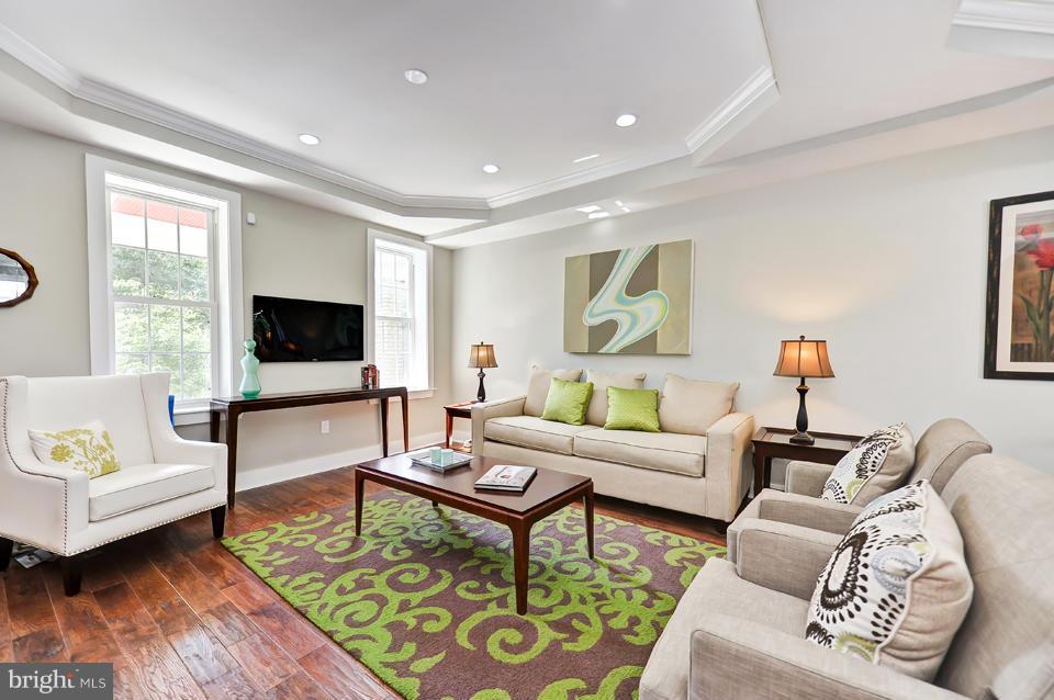 1110 Orren Street Northeast Washington, DC 20002 - Photo 2 of 30 a living room with furniture and a flat screen tv