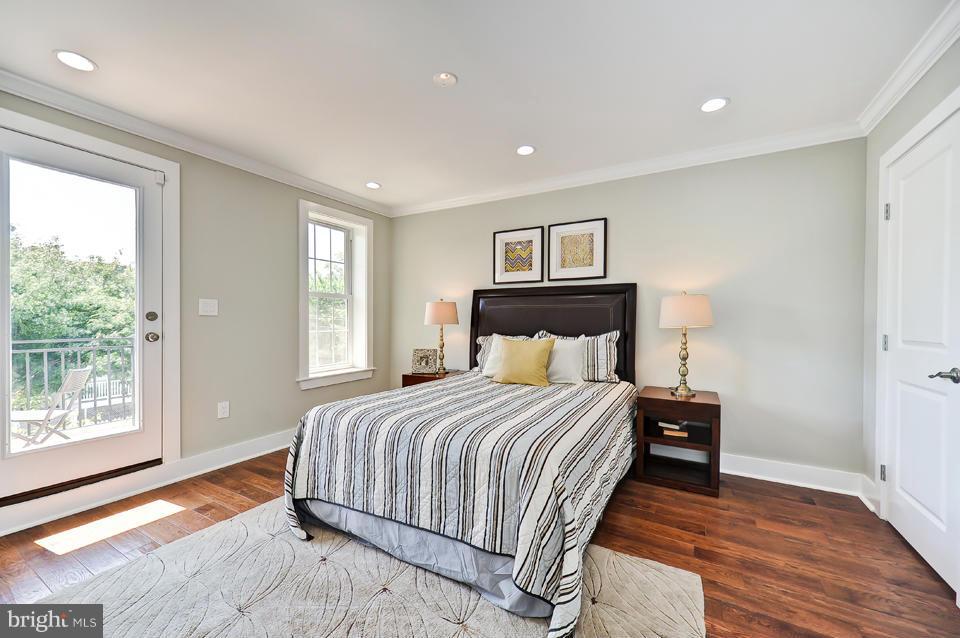 1110 Orren Street Northeast Washington, DC 20002 - Photo 12 of 30 a bedroom with a bed and a large window