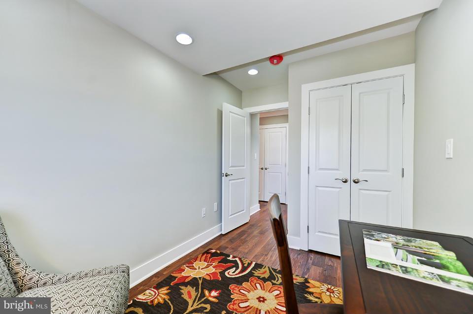 1110 Orren Street Northeast Washington, DC 20002 - Photo 17 of 30 a bedroom with a bed and a dresser