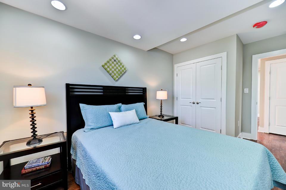 1110 Orren Street Northeast Washington, DC 20002 - Photo 19 of 30 a bedroom with a bed and a lamp