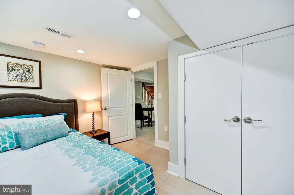 1110 Orren Street Northeast Washington, DC 20002 - Photo 25 of 30 a bedroom with a bed and a walk in closet