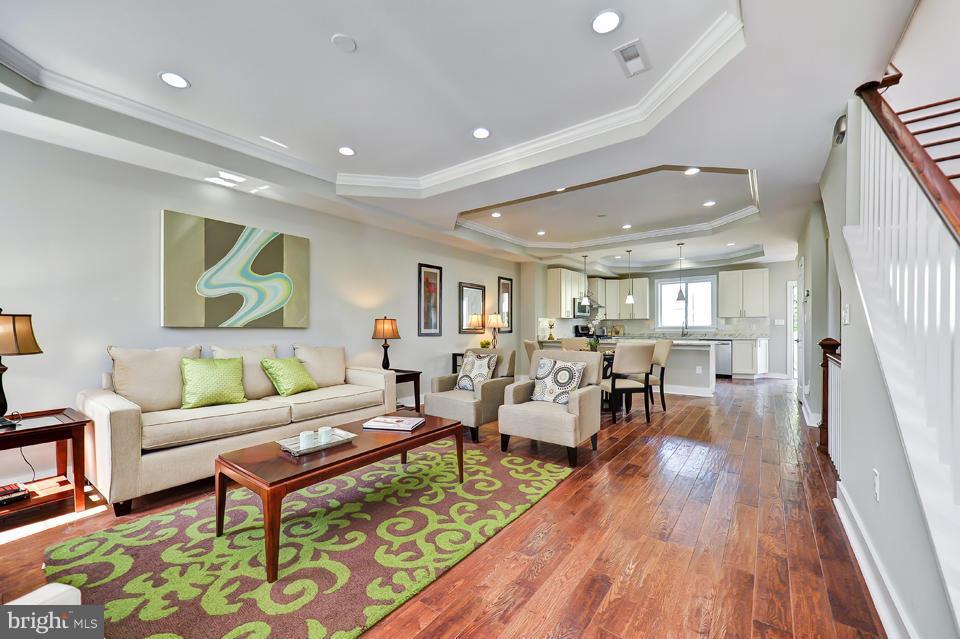 1110 Orren Street Northeast Washington, DC 20002 - Photo 4 of 30 a living room with furniture and a wooden floor