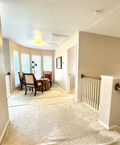 a view of a livingroom with furniture and a window