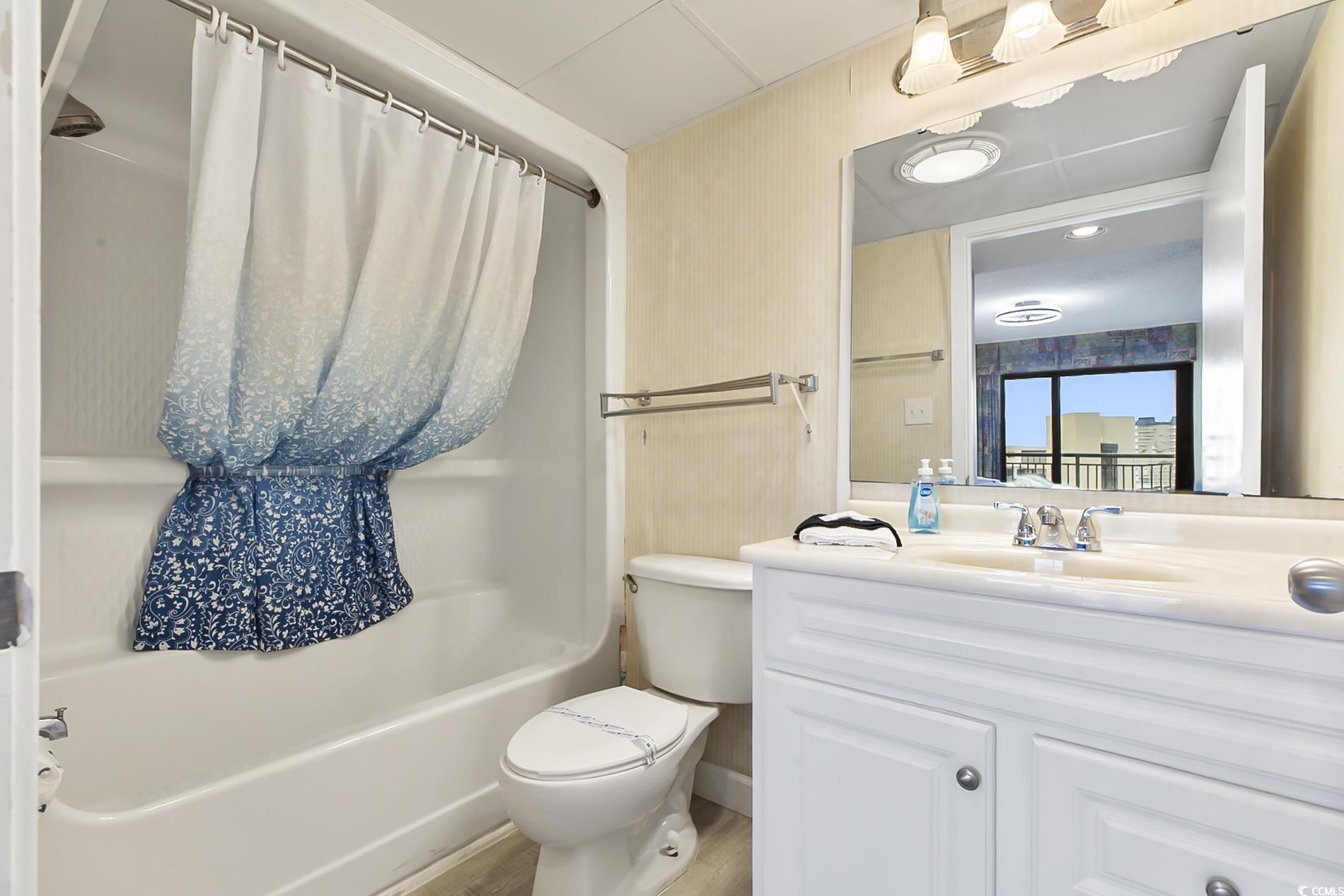 205 74th Avenue North, Unit 708 Myrtle Beach, SC 29572 - Photo 18 of 38 Full bath featuring shower / bathtub combination with curtain and vanity
