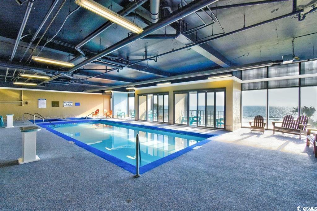 205 74th Avenue North, Unit 708 Myrtle Beach, SC 29572 - Photo 31 of 38 Indoor pool featuring a water view