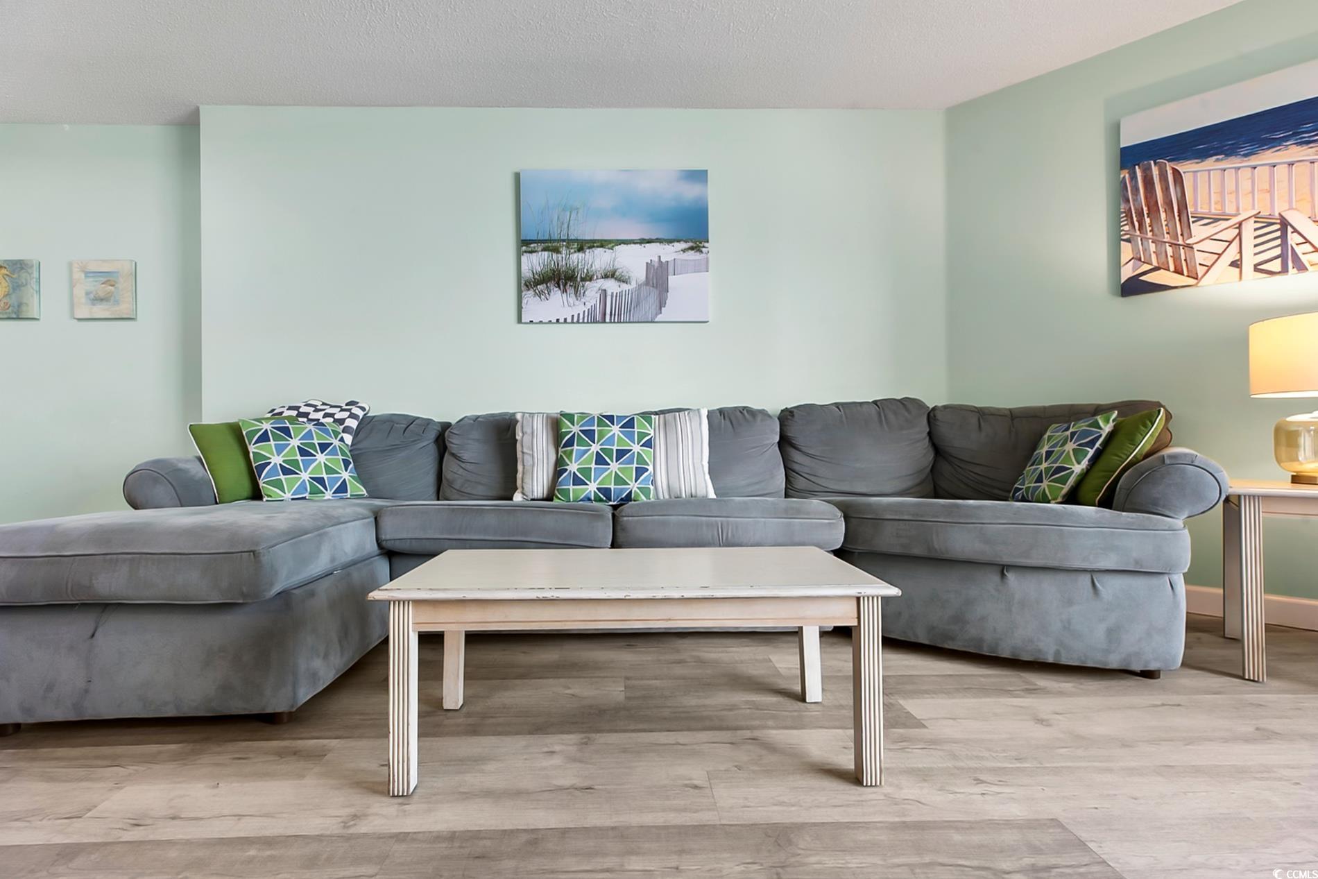 205 74th Avenue North, Unit 708 Myrtle Beach, SC 29572 - Photo 4 of 38 Living area featuring wood finished floors