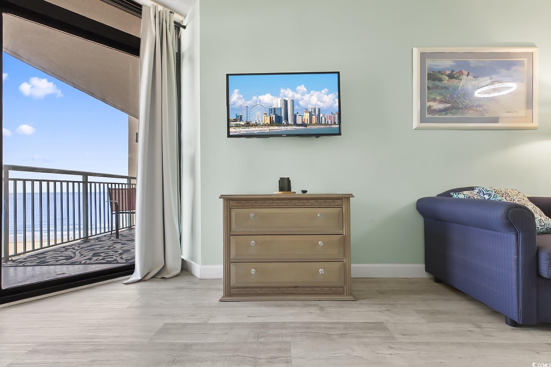 205 74th Avenue North, Unit 708 Myrtle Beach, SC 29572 - Photo 5 of 38 Sitting room featuring baseboards and light wood-style flooring