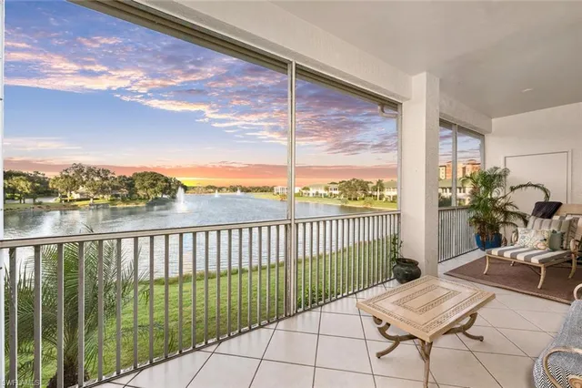 a view of a balcony with chair and table