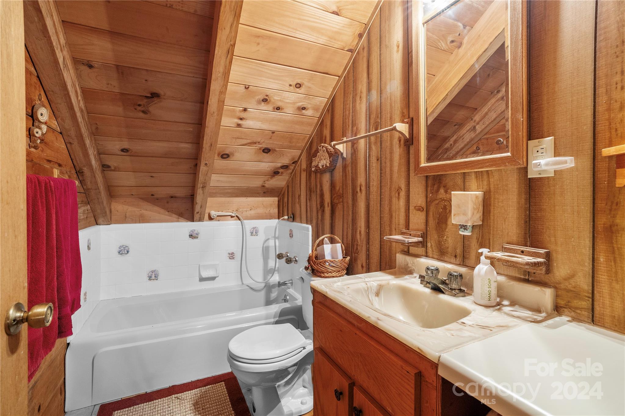 341 Soco Acres Road Maggie Valley, NC 28751 - Photo 21 of 42 a bathroom with a sink toilet and shower