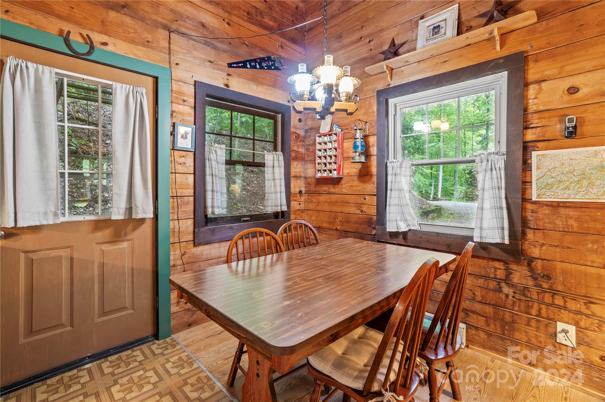 341 Soco Acres Road Maggie Valley, NC 28751 - Photo 8 of 42 a dining room with a table and chairs