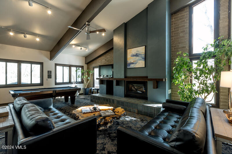 1020 Vail View Drive, Unit 340847 Vail, CO 81657 - Photo 22 of 25 a living room with furniture fireplace and window