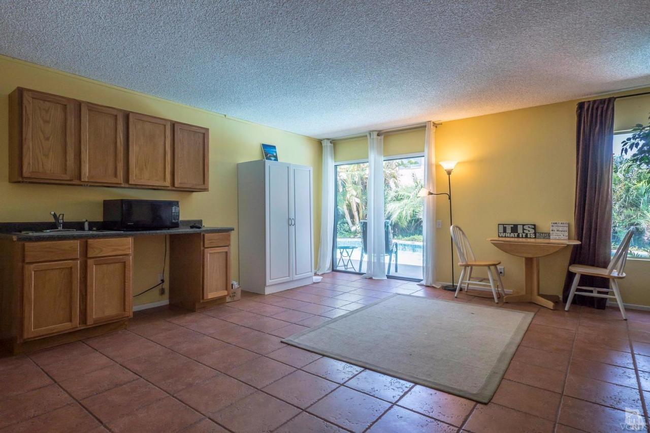 11529 East Buttercreek Road Moorpark, CA 93021 - Photo 16 of 36 a view of a kitchen with furniture and a kitchen