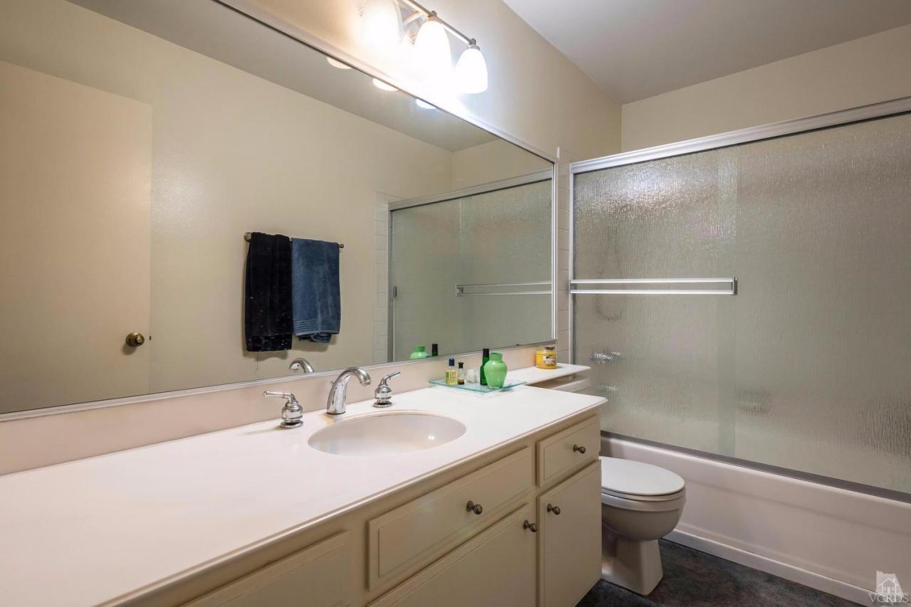 11529 East Buttercreek Road Moorpark, CA 93021 - Photo 27 of 36 a bathroom with a sink and a mirror