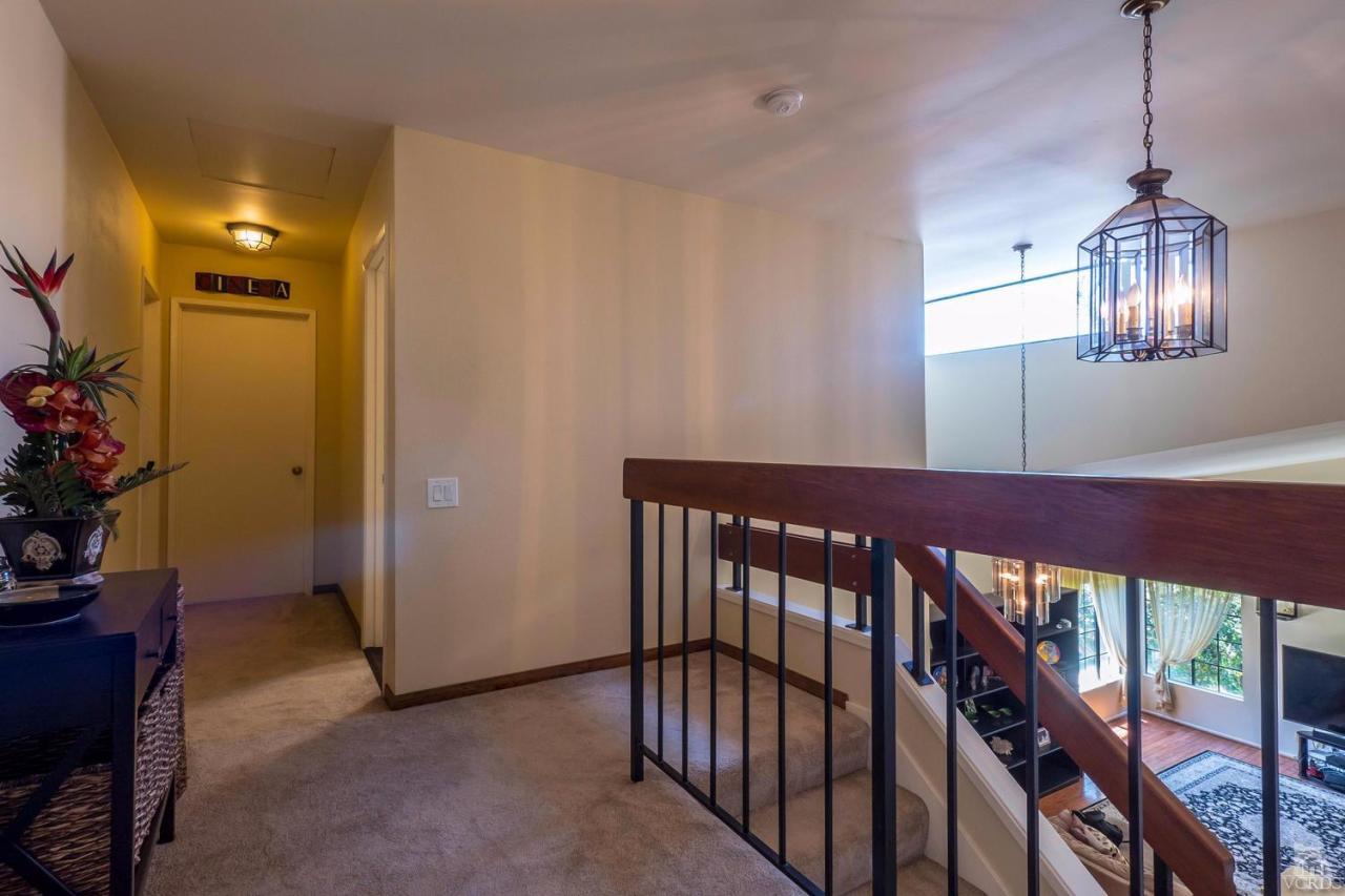 11529 East Buttercreek Road Moorpark, CA 93021 - Photo 28 of 36 a view of a hallway to room with furniture and a potted plant