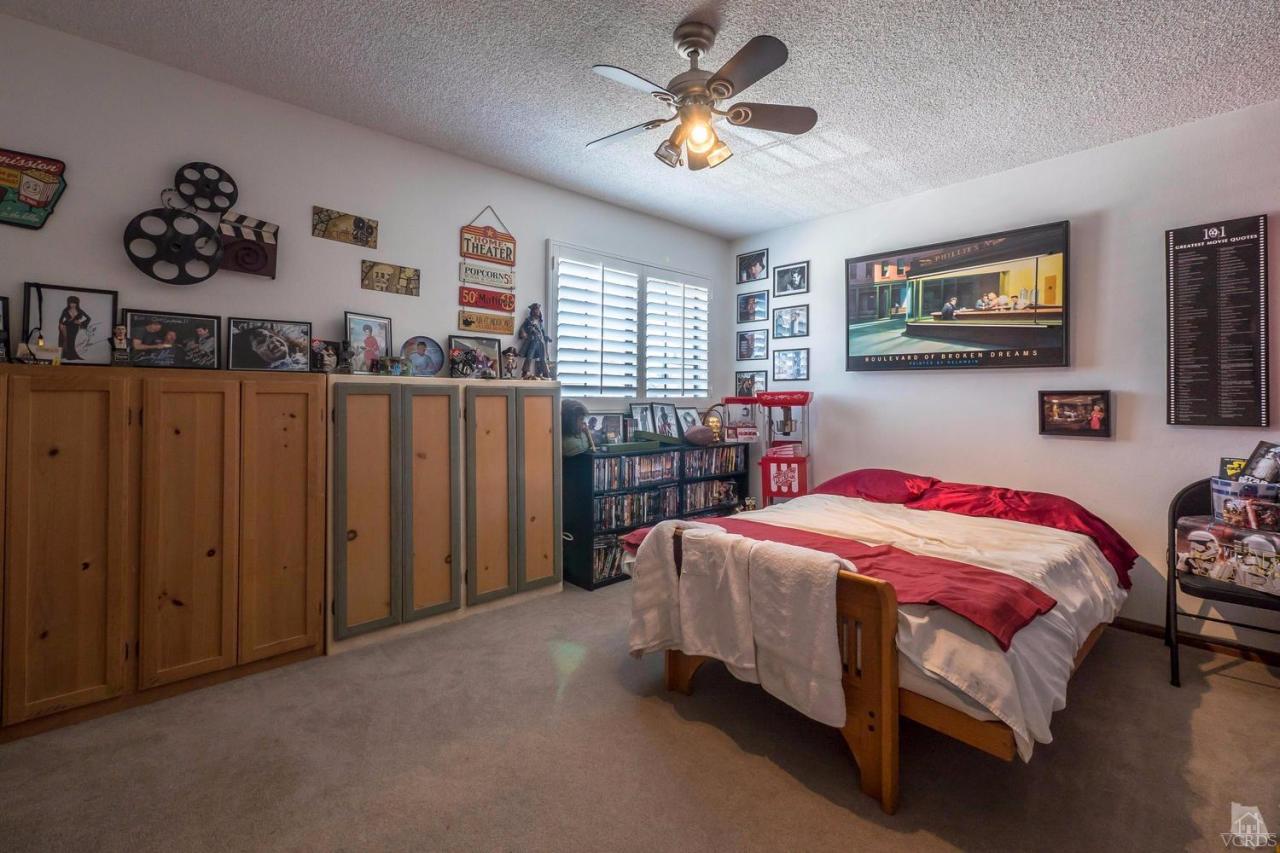 11529 East Buttercreek Road Moorpark, CA 93021 - Photo 29 of 36 a bedroom with a bed and a tv