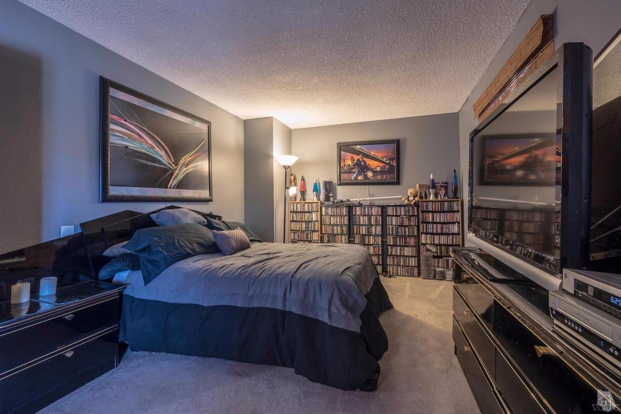11529 East Buttercreek Road Moorpark, CA 93021 - Photo 30 of 36 a bed room with a bed and a television