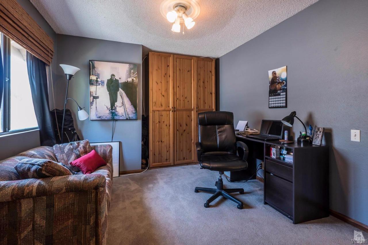 11529 East Buttercreek Road Moorpark, CA 93021 - Photo 32 of 36 a view of a workspace with furniture and a window