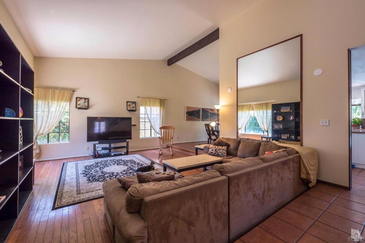 11529 East Buttercreek Road Moorpark, CA 93021 - Photo 6 of 36 a living room with furniture and a flat screen tv