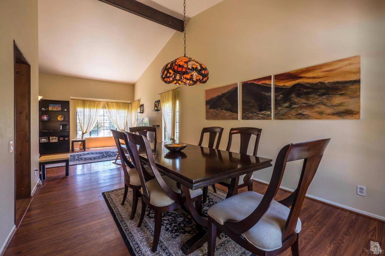11529 East Buttercreek Road Moorpark, CA 93021 - Photo 9 of 36 a view of a dining room with furniture and wooden floor
