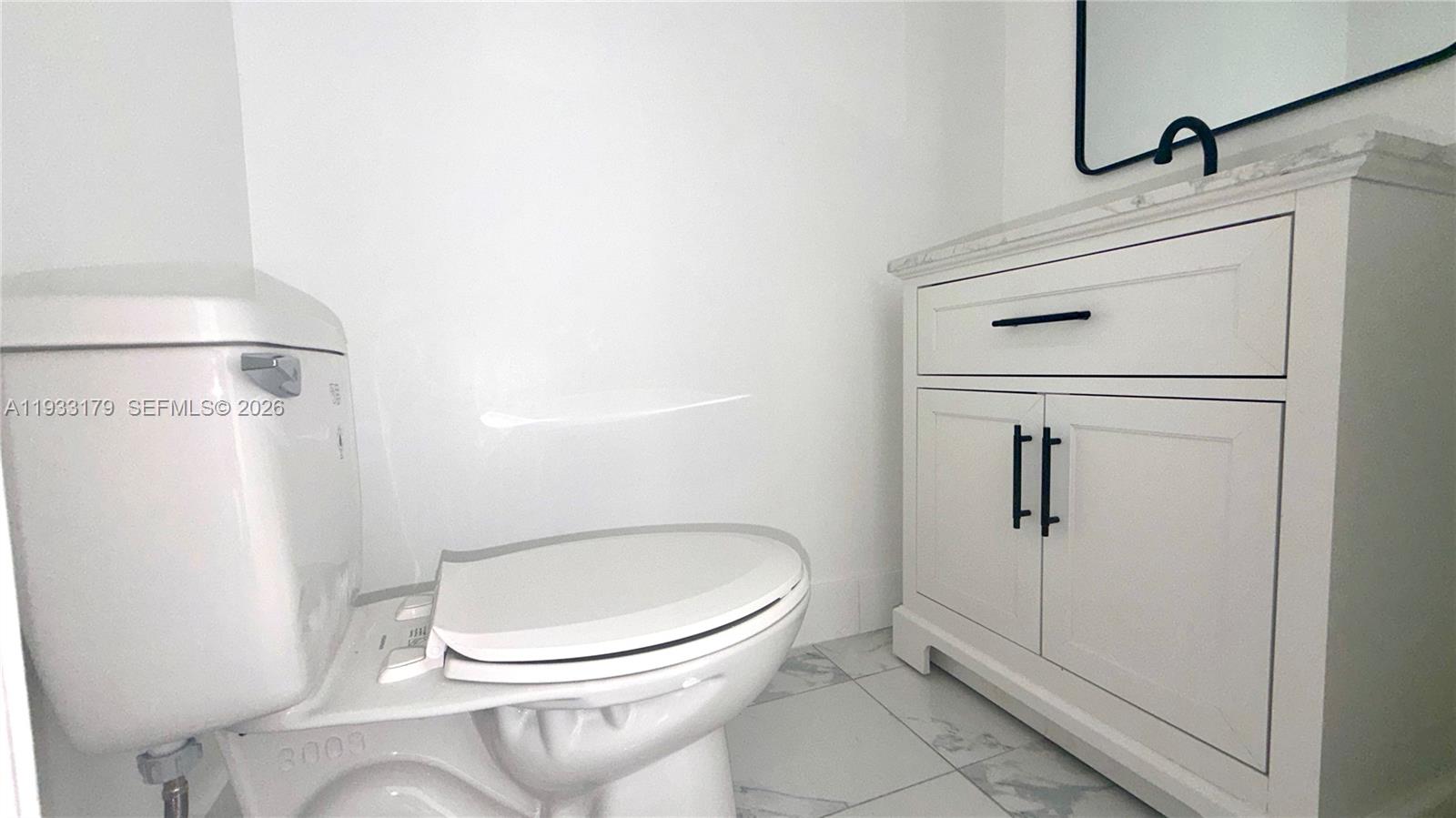 1629 Northwest 40th Street Miami, FL 33142 - Photo 12 of 17 a bathroom with a toilet and a shower