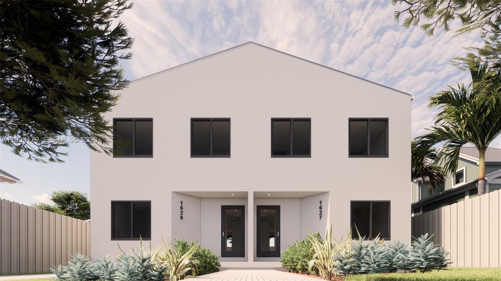 1629 Northwest 40th Street Miami, FL 33142 - Photo 16 of 17 a front view of a house with plants