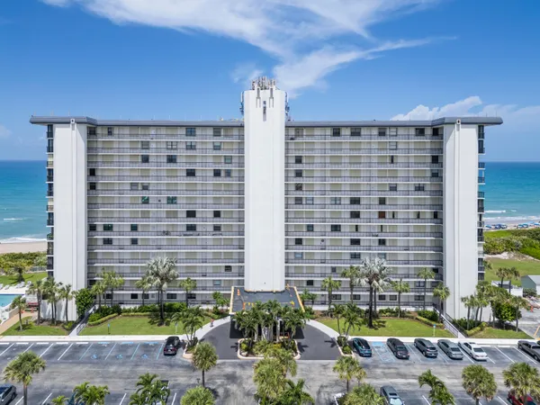 a front view of a building with outdoor space
