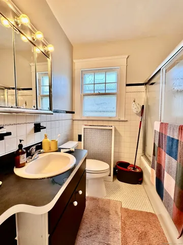 a bathroom with a sink double vanity and a tub