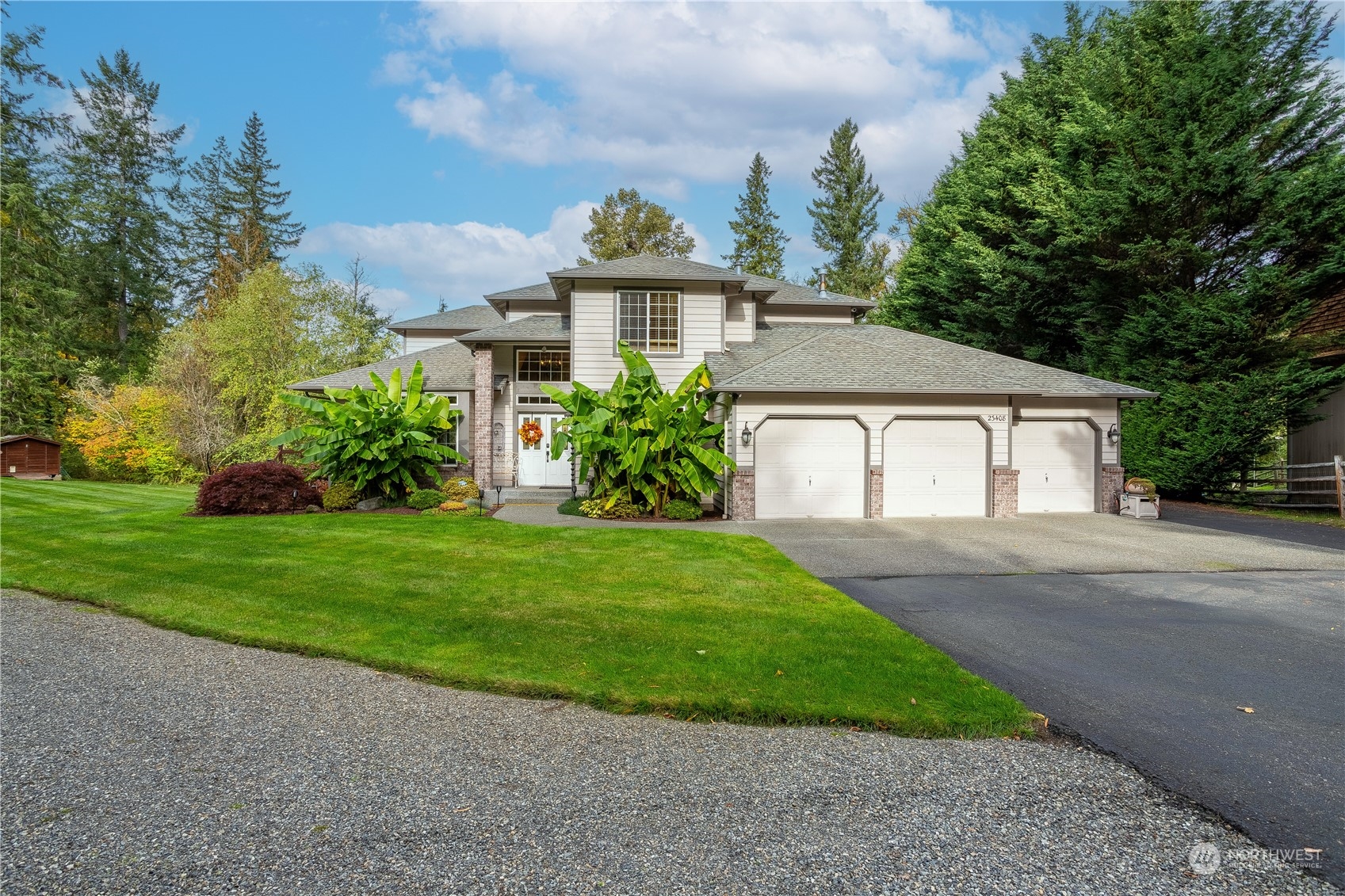a front view of a house with garden
