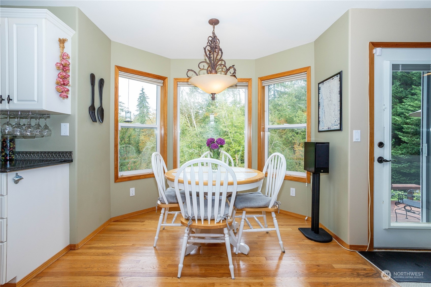 23408 Southeast 216th Way Maple Valley, WA 98038 - Photo 14 of 40 a dining room with furniture window wooden floor