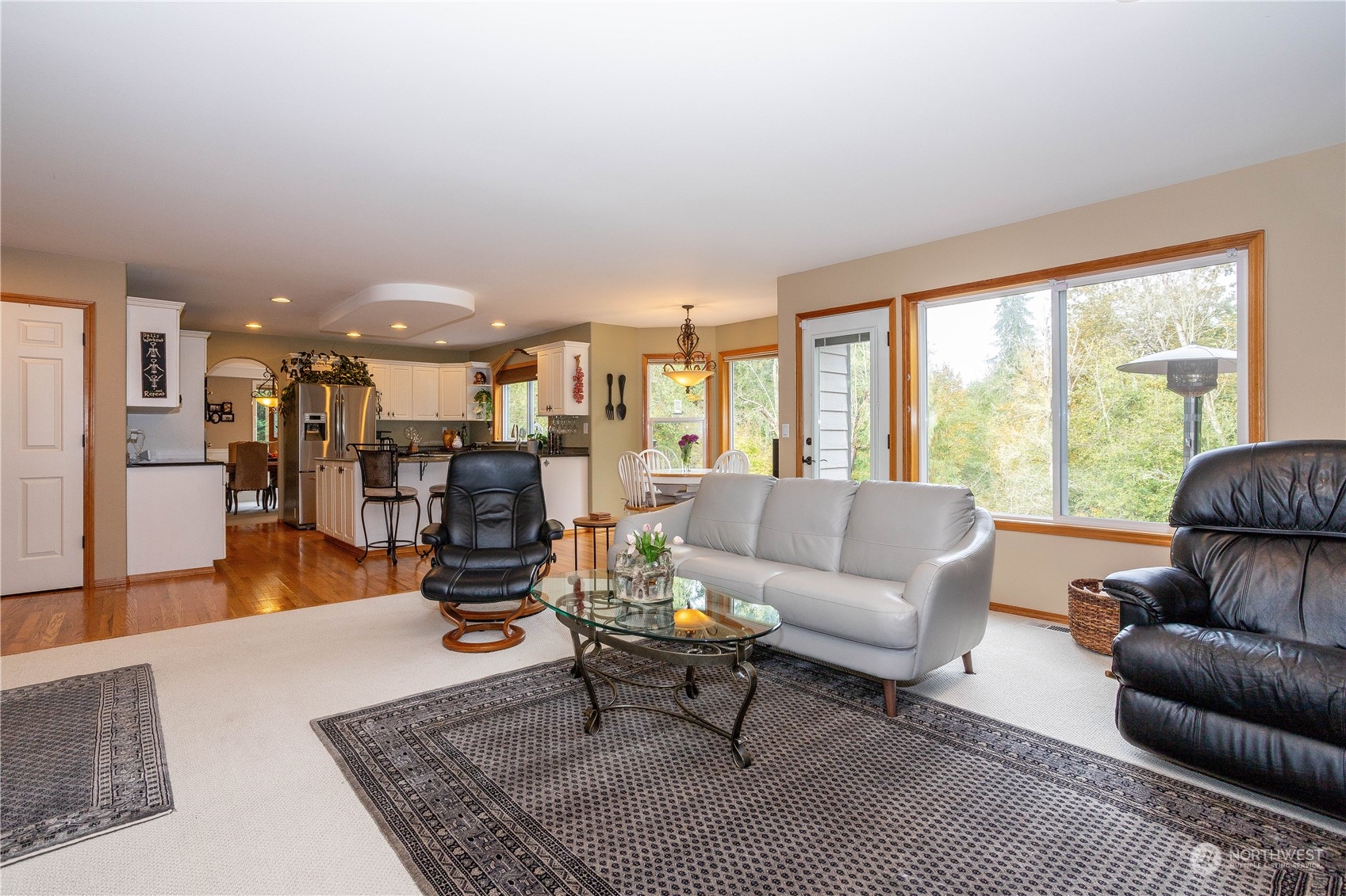 23408 Southeast 216th Way Maple Valley, WA 98038 - Photo 15 of 40 a living room with furniture and a table