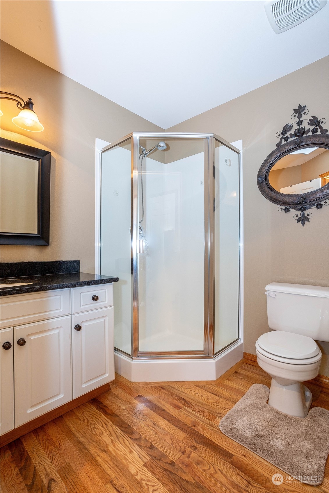 23408 Southeast 216th Way Maple Valley, WA 98038 - Photo 17 of 40 a bathroom with a sink toilet and shower