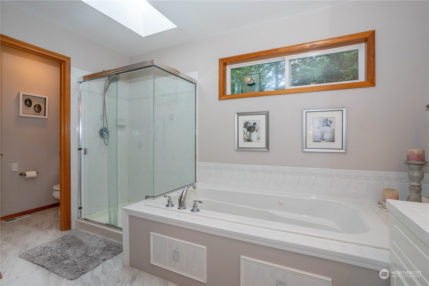 23408 Southeast 216th Way Maple Valley, WA 98038 - Photo 25 of 40 a bathroom with a bathtub and a sink