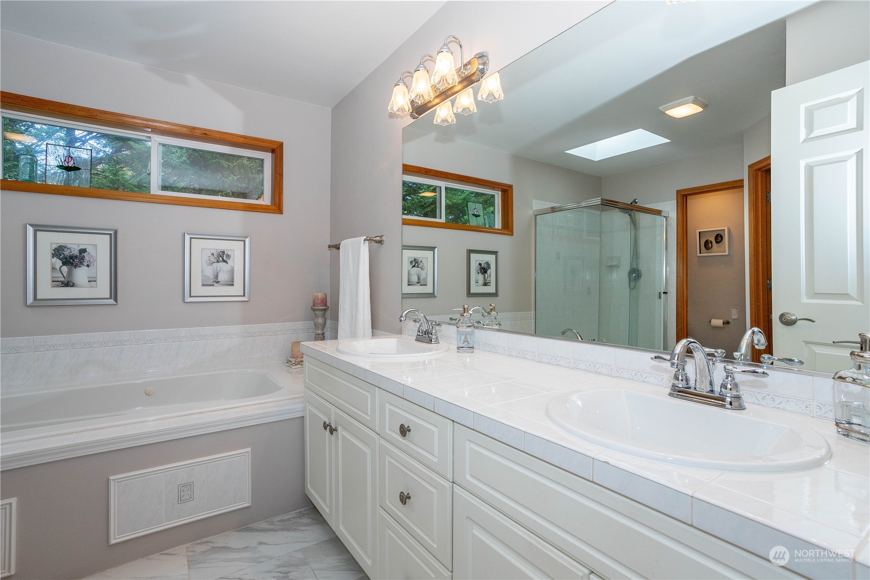23408 Southeast 216th Way Maple Valley, WA 98038 - Photo 26 of 40 a bathroom with a double vanity sink mirror and bathtub