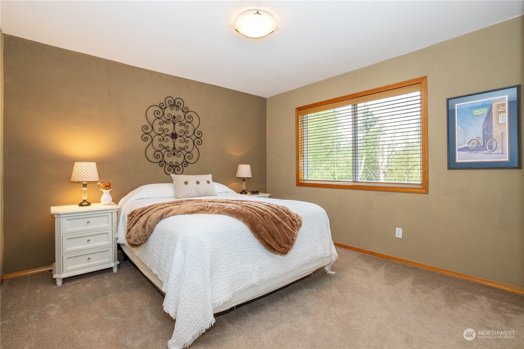 23408 Southeast 216th Way Maple Valley, WA 98038 - Photo 29 of 40 a bedroom with a bed and a window