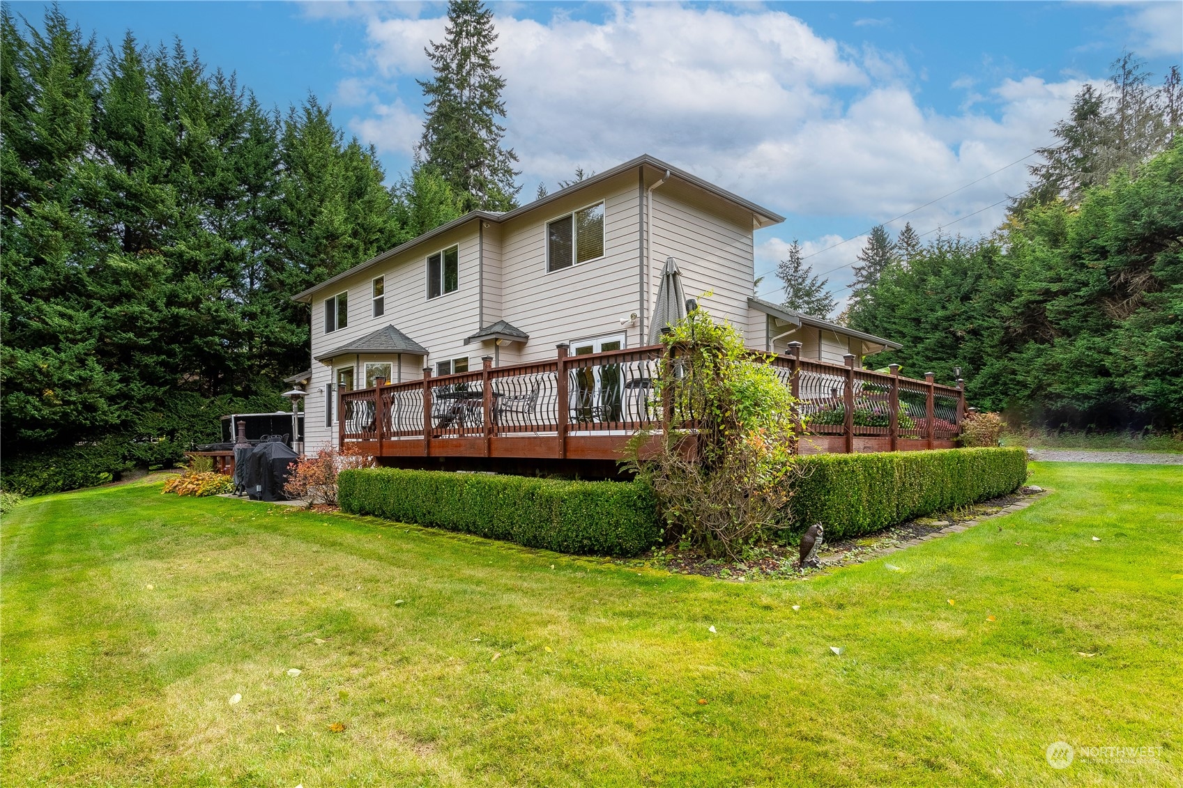 23408 Southeast 216th Way Maple Valley, WA 98038 - Photo 33 of 40 a view of a house with a yard and sitting area