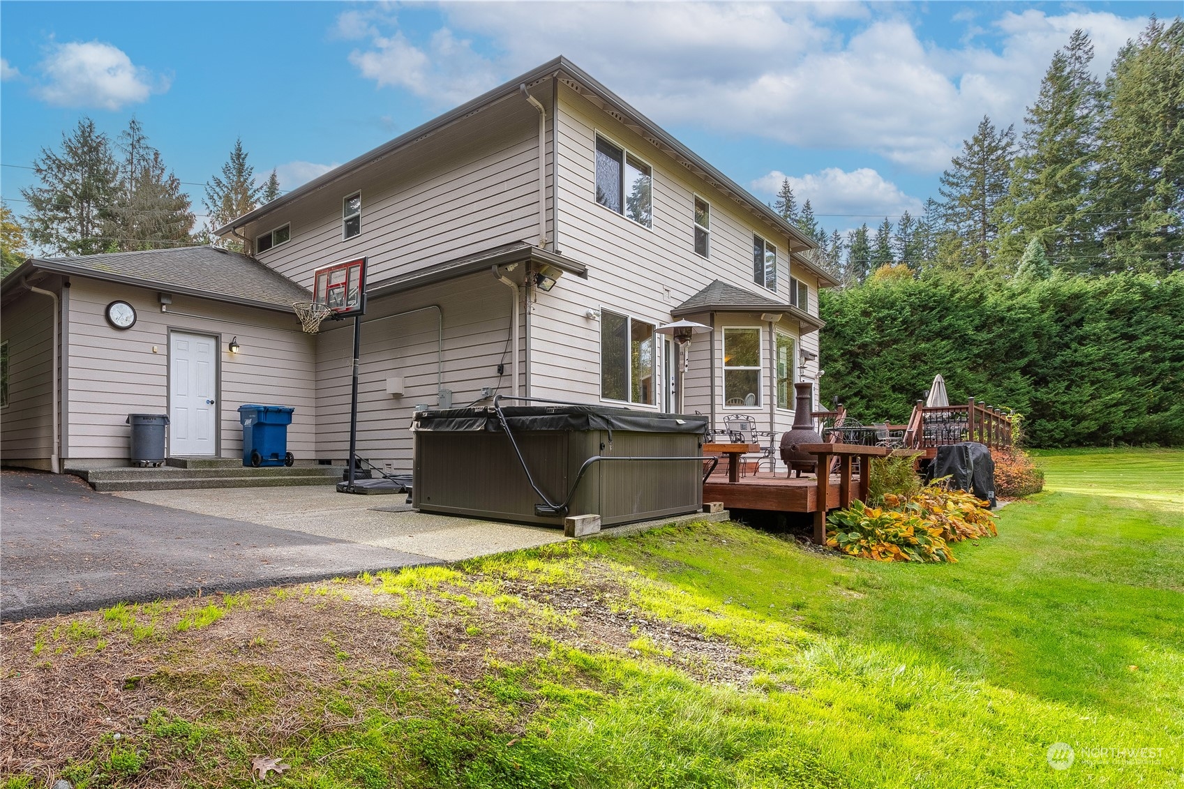23408 Southeast 216th Way Maple Valley, WA 98038 - Photo 34 of 40 a view of a house with a backyard and a patio